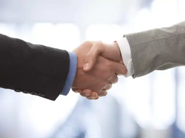 Close-up of a professional handshake symbolizing partnership, trust, and business agreement.