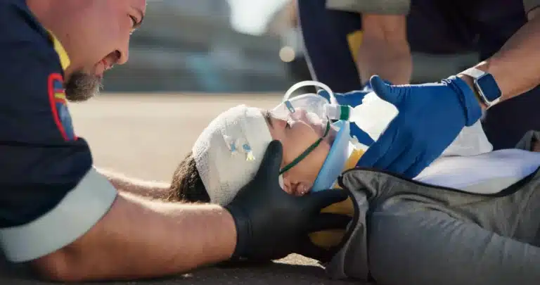 An accident victim being treated by paramedics