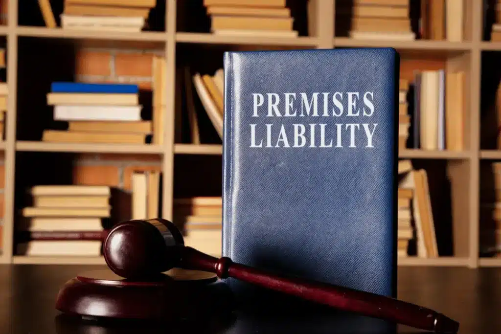 A gavel and premises liability handbook on a table