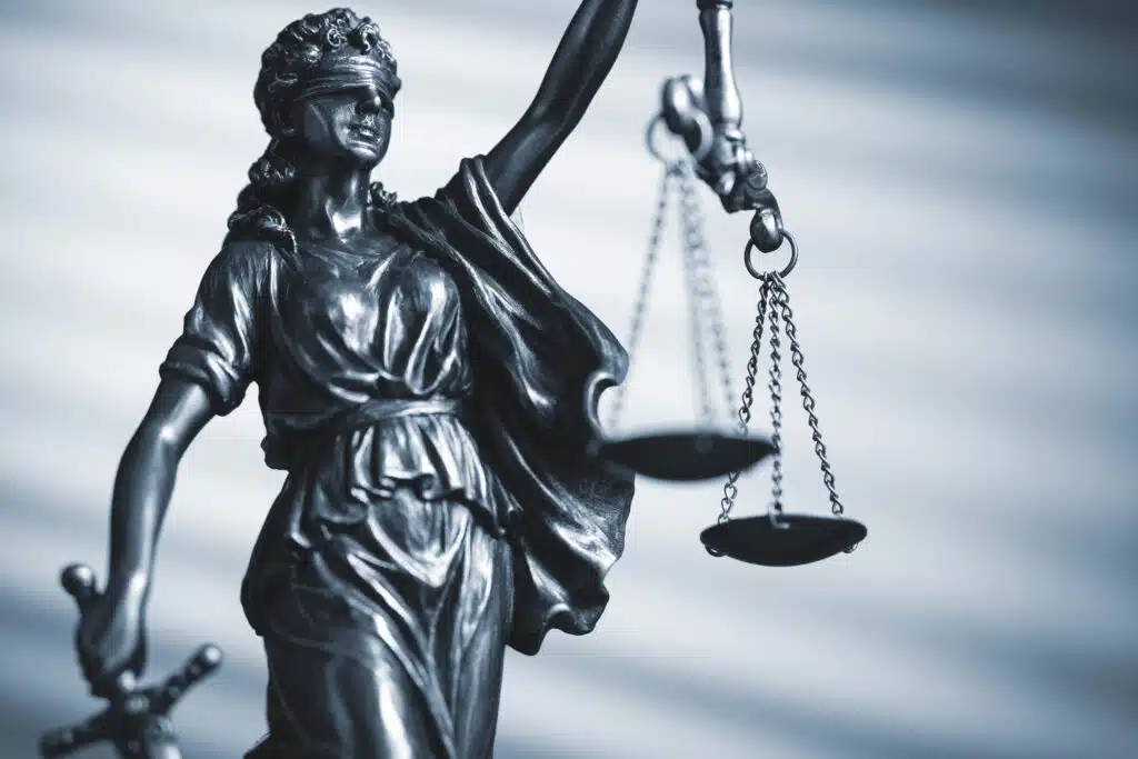 Statue of Lady Justice holding balanced scales
