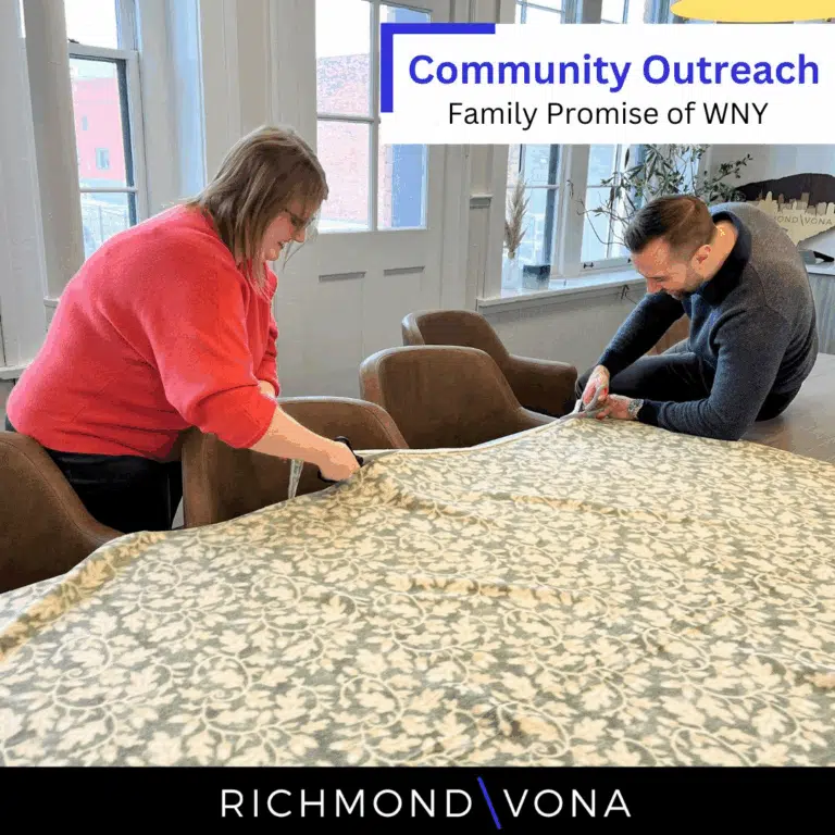 Richmond Vona team members setting up indoors