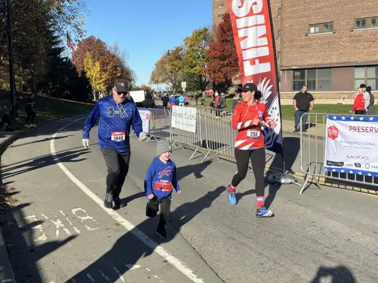 Richmond Vona team members participating in a community fun run with families