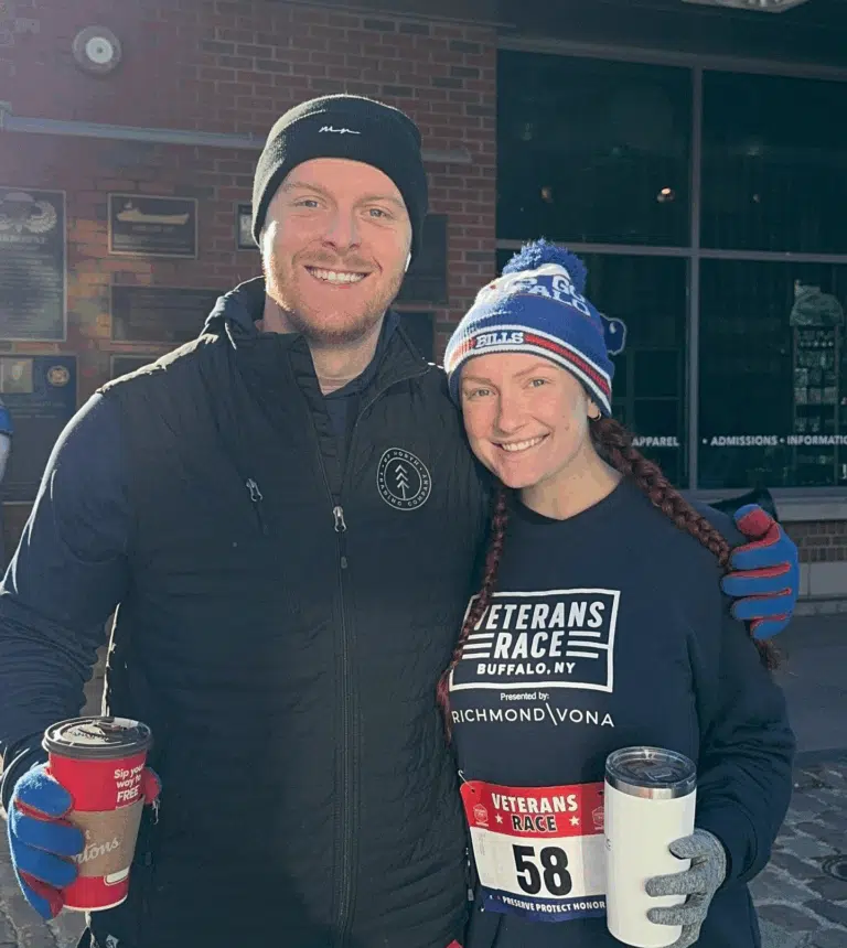 Two participants at the Richmond Vona Veterans Race event posing together outdoors
