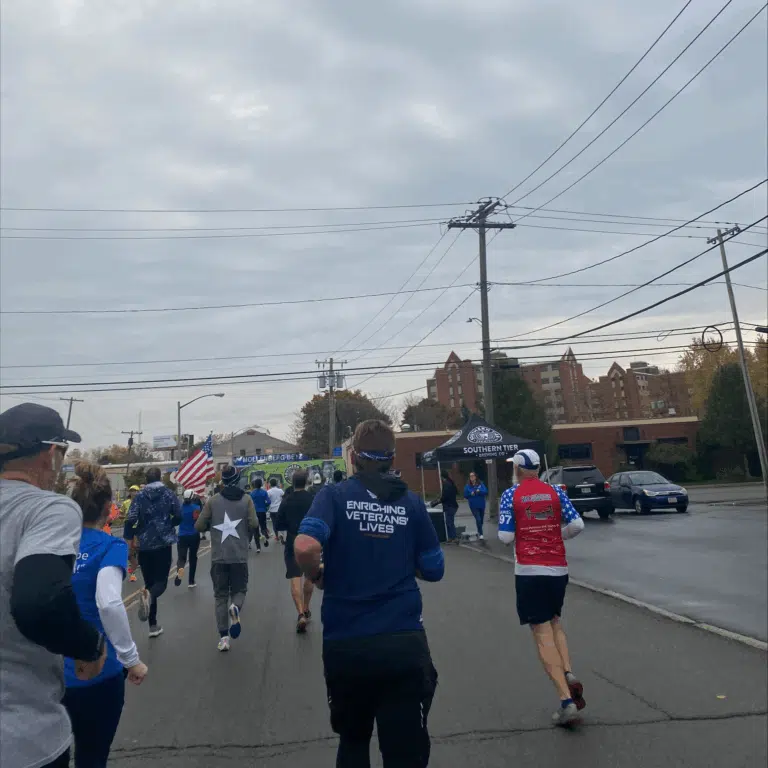 Participants running together during a community race event