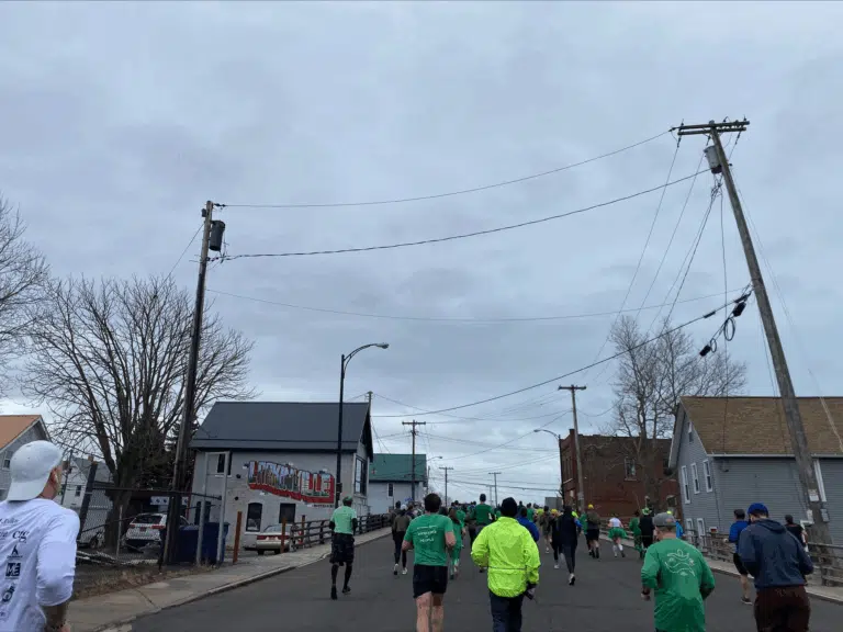 Participants walking together during a community outreach run