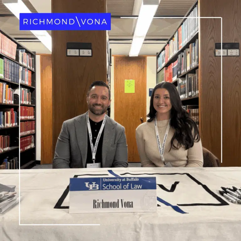 ohn Richmond seated at an outreach table at the University at Buffalo School of Law