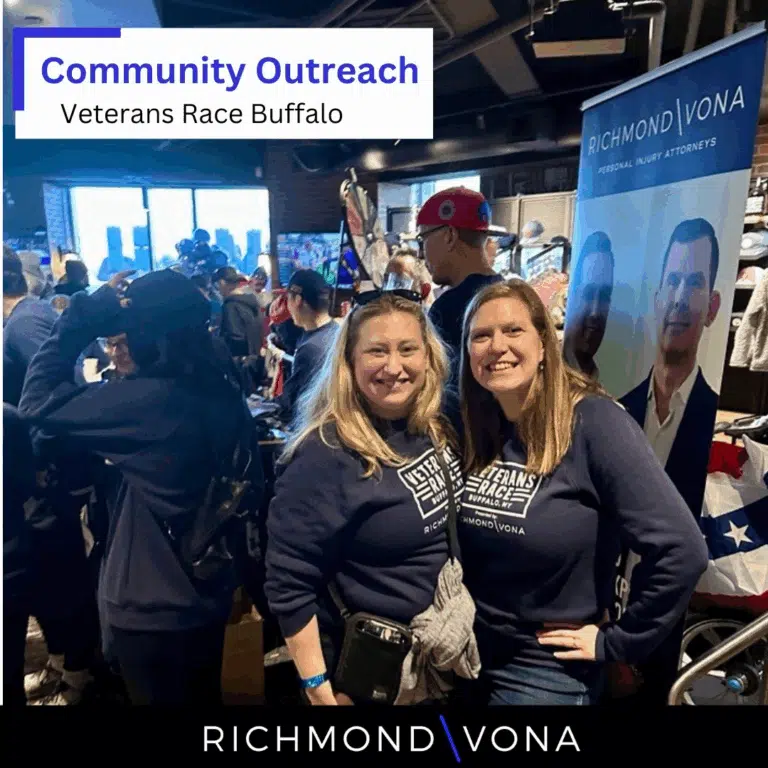 Two people posing together at a Richmond Vona community outreach event