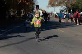 Veterans Race Buffalo NY Kid Running in Front