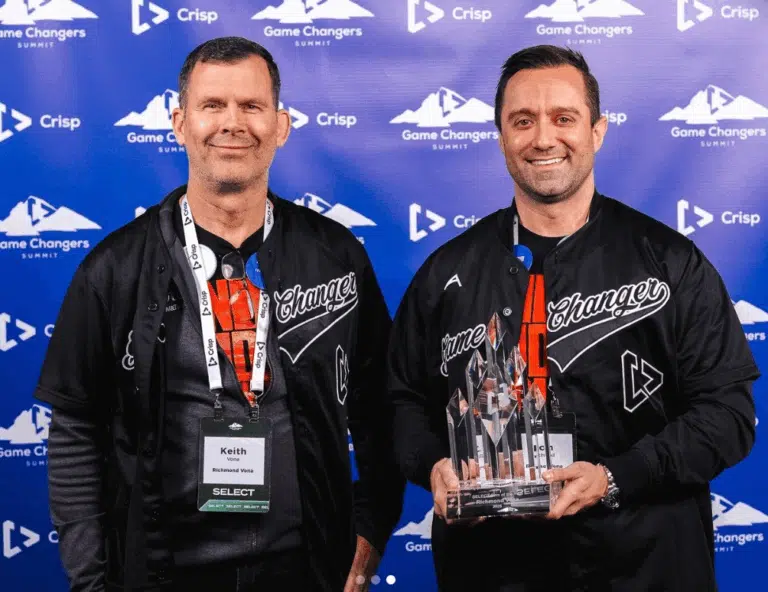 John Richmond and Keith Vona holding Crisp Select Firm of the Year award at Crisp's Gamechanger Summit