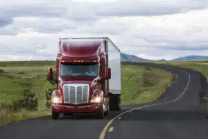 truck on a highway through the grasslands area