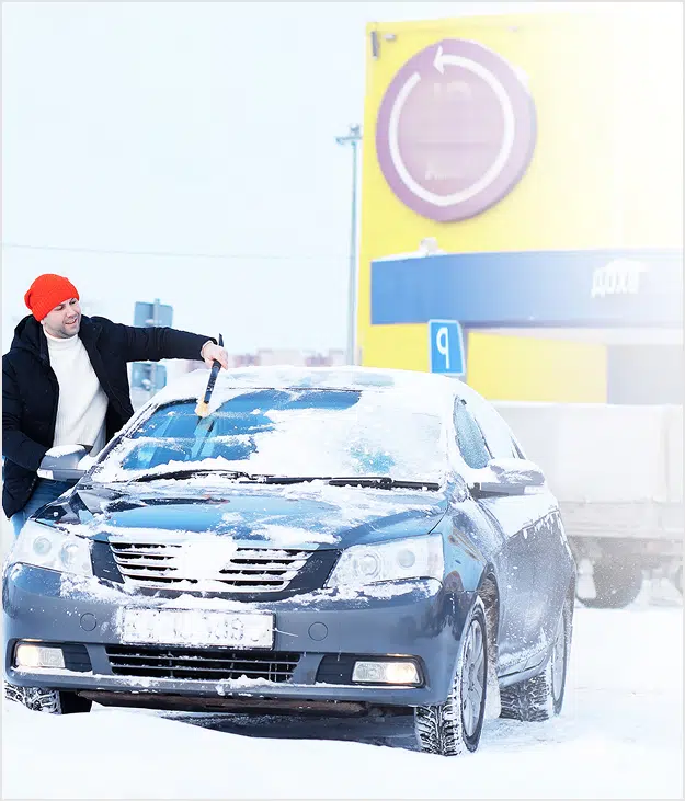 A Male Driver Is Standing In Front Of