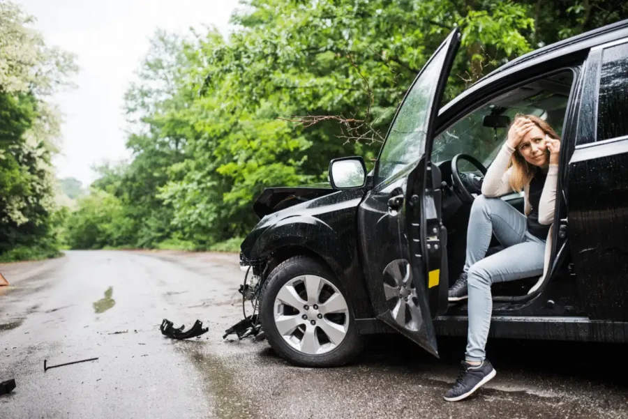 Woman making phone call after an accident