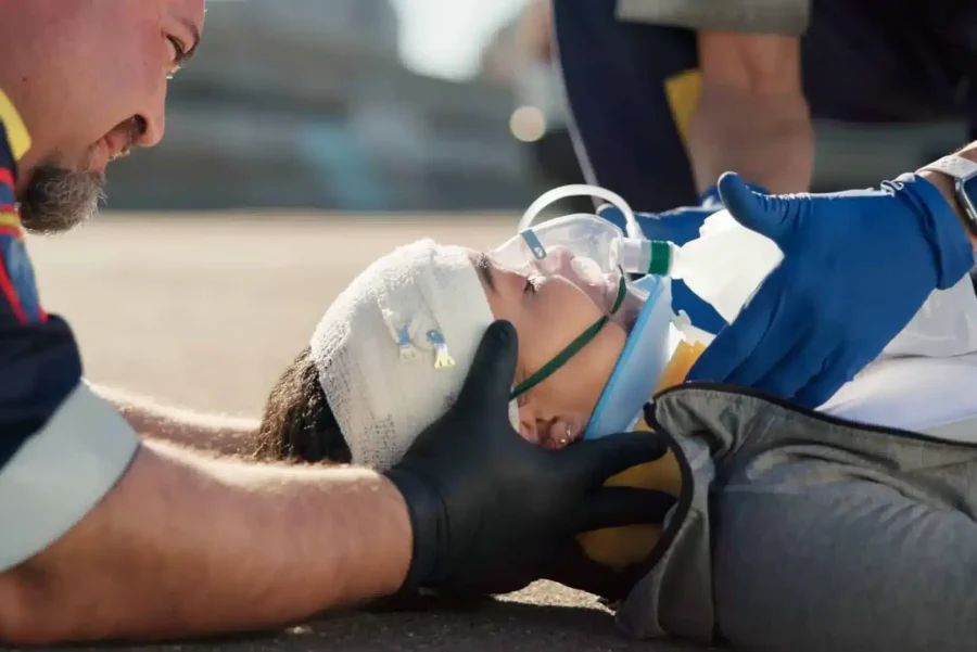 An accident victim being treated by paramedics